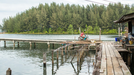 KOH CHANG - THAILAND - DEC 22, 2015: Unidentified locals in fisherman's village. Island is on Gulf of Thailand, near border with Cambodia, population of 5356 people living in 8 villages.のeditorial素材