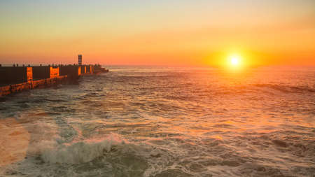 Surf on the coast during an amazing sunset.の写真素材