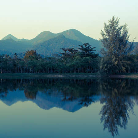 Landscape of mountains reflected in the lake. Thailand.の写真素材