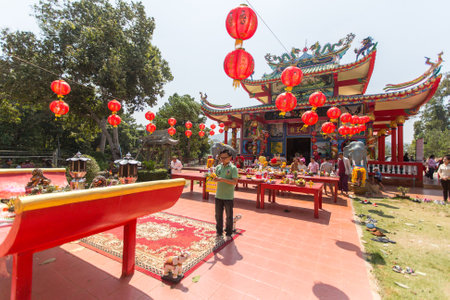 KOH CHANG, THAILAND - JAN 7, 2016: During the celebration Chinese New Year in the Chinese temple. 4714 year (traditional lunisolar Chinese calendar) begins February 8, characters: Monkey, fire, red.のeditorial素材