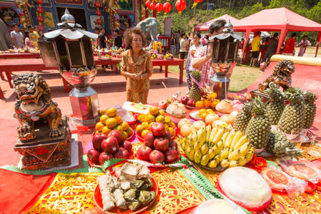 KOH CHANG, THAILAND - JAN 7, 2016: During the celebration Chinese New Year in the Chinese temple. 4714 year (traditional lunisolar Chinese calendar) begins February 8, characters: Monkey, fire, red.のeditorial素材