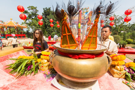 KOH CHANG, THAILAND - JAN 7, 2016: Unidentified participants during the celebration Chinese New Year in Koh Chang Chinese temple. Now begins 4714 year according traditional lunisolar Chinese calendar.のeditorial素材