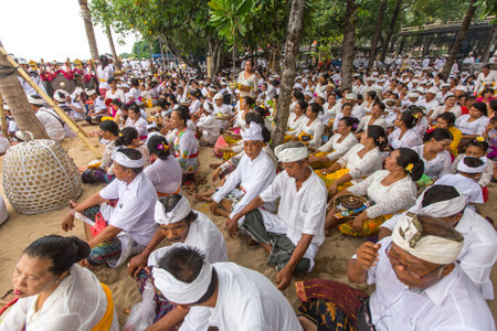 SANUR, BALI - MAR 18, 2016: Unidentified local people during ceremony Melasti Ritual. Melasti is a Hindu Balinese purification ceremony and one of the most important rituals of Bali island.のeditorial素材