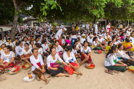 SANUR, BALI - MAR 18, 2016: Unidentified local people during ceremony Melasti Ritual. Melasti is a Hindu Balinese purification ceremony and one of the most important rituals of Bali island.のeditorial素材
