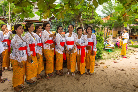 SANUR, BALI - MAR 18, 2016: Unidentified local people during performed Melasti Ritual. Melasti is a Hindu Balinese purification ceremony and ritual is held several days prior to the Nyepi holy day.のeditorial素材