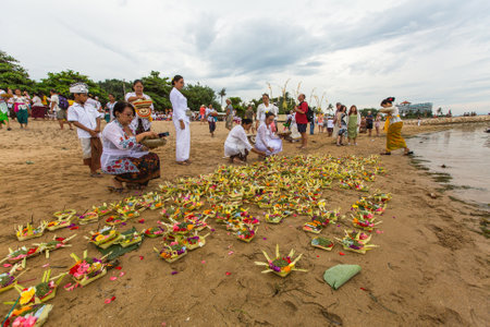 SANUR, BALI - MAR 18, 2016: Unidentified people during Melasti Ritual. Ceremony is held on the edge of the beach with the aim to purify oneself of all the bad things in the past and throw it to ocean.のeditorial素材