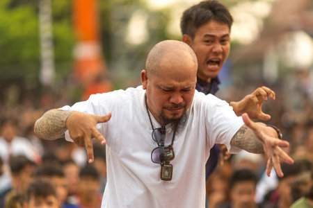 WAT BANG PHRA, THAILAND - MAR 19, 2016: Unknown participants of Master Day Ceremony at able Khong Khuen (spirit possession) during the Wai Kroo ritual at Bang Pra monastery, about 50 km of Bangkok.のeditorial素材