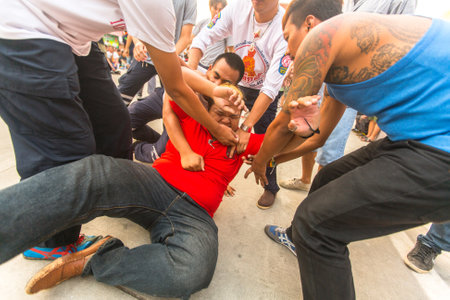 WAT BANG PHRA, THAILAND - MAR 19, 2016: Unknown participants of Master Day Ceremony at able Khong Khuen - spirit possession during the Wai Kroo ritual at Bang Pra monastery, about 50 km west of Bangkok.のeditorial素材