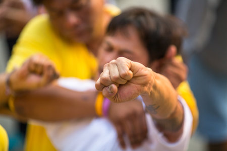 WAT BANG PHRA, THAILAND - MAR 19, 2016: Unknown participants of Master Day Ceremony at able Khong Khuen - spirit possession during the Wai Kroo ritual at Bang Pra monastery, about 50 km west of Bangkok.のeditorial素材
