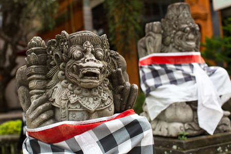 Traditional demon statue carved in stone on Bali, Indonesia.の写真素材