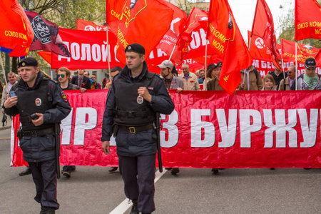 MOSCOW, RUSSIA - MAY 1, 2016: Unidentified Communist party supporters together with National Bolsheviks take part in a rally marking the May Day in the  center of Moscow.のeditorial素材