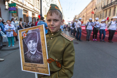 St.PETERSBURG, RUSSIA - MAY 9, 2016: Participants of Immortal Regiment - public action, during which participants carried banners/portraits of their relatives who participated in Great Patriotic War.のeditorial素材
