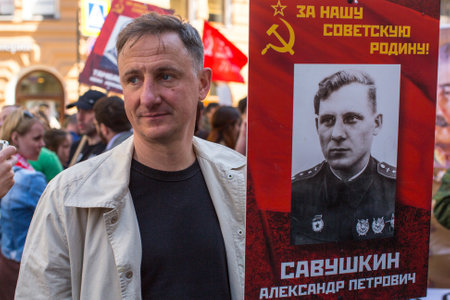 St.PETERSBURG, RUSSIA - MAY 9, 2016: Participants of Immortal Regiment - public action, during which participants carried banners/portraits of their relatives who participated in Great Patriotic War.のeditorial素材