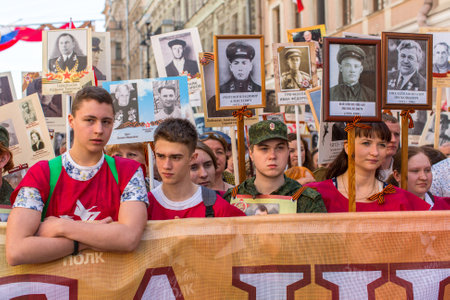 St.PETERSBURG, RUSSIA - MAY 9, 2016: Participants of Immortal Regiment - public action, during which participants carried banners/portraits of their relatives who participated in Great Patriotic War.のeditorial素材