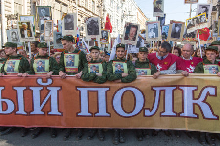 St.PETERSBURG, RUSSIA - MAY 9, 2016: Participants of Immortal Regiment - public action, during which participants carried banners/portraits of their relatives who participated in Great Patriotic War.のeditorial素材