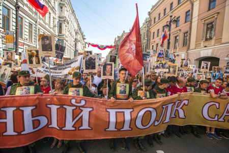 St.PETERSBURG, RUSSIA - MAY 9, 2016: Participants of Immortal Regiment - public action, during which participants carried portraits of their relatives who participated in Great Patriotic War.のeditorial素材