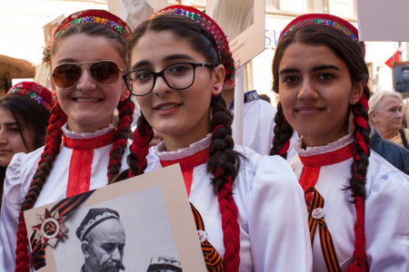 St.PETERSBURG, RUSSIA - MAY 9, 2016: Participants of Immortal Regiment - public action, during which participants carried banners/portraits of their relatives who participated in Great Patriotic War.のeditorial素材