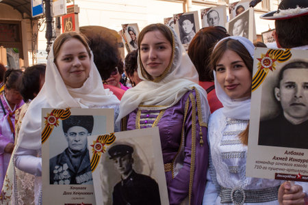 St.PETERSBURG, RUSSIA - MAY 9, 2016: Participants of Immortal Regiment - public action, during which participants carried banners/portraits of their relatives who participated in Great Patriotic War.のeditorial素材