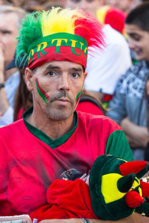 PORTO, PORTUGAL - JUL 10, 2016: Portuguese fans during video translation of the football match Portugal - France final of the European championship 2016, in Liberdade Square at city center of Porto.のeditorial素材