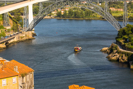 PORTO, PORTUGAL - JUL 12, 2016: Tourist boats on the Douro river at Ribeira, historical center of Porto. City of Porto won the European Best Destination 2012 and 2014 awards.のeditorial素材