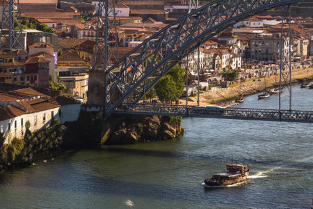PORTO, PORTUGAL - JUL 12, 2016: Tourist boats on the Douro river at Ribeira, historical center of Porto. City of Porto won the European Best Destination 2012 and 2014 awards.のeditorial素材