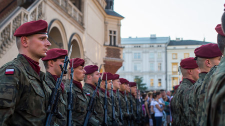 KRAKOW, POLAND - FEB 10, 2016: Polish soldiers on guard of the ceremony is the vow of first classes of the Jan III Sobieski High School (founded 1883) at the Main Market Square near St.Mary Cathedral.のeditorial素材