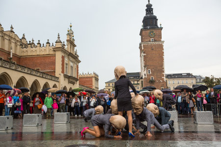 KRAKOW, POLAND - SEP 17, 2016: Participants of Krakow Theatre Night festival -KTO Teatre (Peregrinus, written and directed by J.Zon) in Main Market Square. Entry to all shows of Theatre Night is free.のeditorial素材