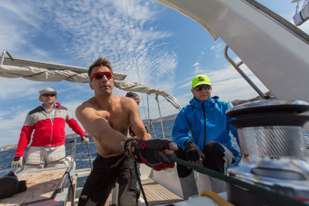 MILOS, GREECE - SEP 26, 2016: Sailors participate in sailing regatta 16th Ellada Autumn 2016 among Greek island group in the Aegean Sea, in Cyclades and Saronic Gulf.のeditorial素材