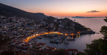Top view twilight of Hydra island, Greece - city center and yaht marina after sunset.の写真素材