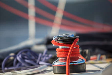Sailboat winch and rope yacht detail. Yachting on the Sea.の写真素材