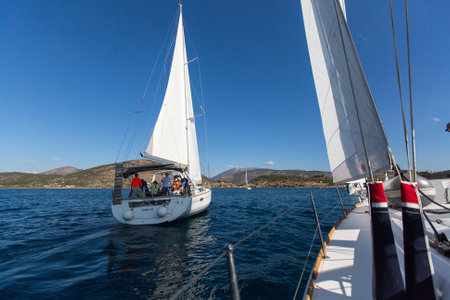 HYDRA, GREECE - SEP 28, 2016: Sailors participate in sailing regatta 16th Ellada Autumn 2016 among Greek island group in the Aegean Sea, in Cyclades and Saronic Gulf.のeditorial素材