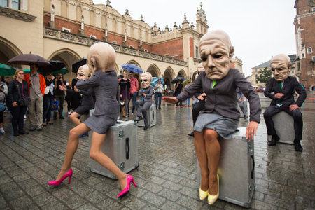 KRAKOW, POLAND - SEP 17, 2016: Participants of Krakow Theatre Night festival - KTO Teatre (Peregrinus, written by J. Zon) in Main Market Square. Entry to all shows of Theatre Night is free.のeditorial素材