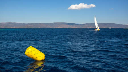 Finish line buoy at sailing sea yacht race regattas. Luxery vacations, adventure, travel.の写真素材