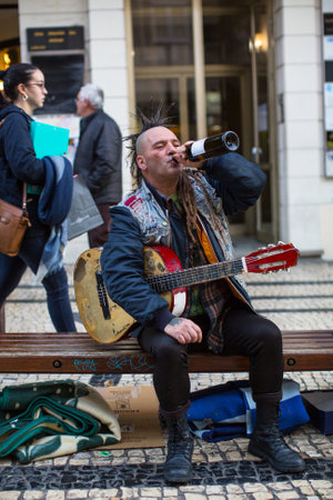 PORTO, PORTUGAL - DEC 9, 2016: Unknown street musician on the one of the streets in the historical centre of Porto old town. City of Porto won the European Best Destination 2012 and 2014 awards.のeditorial素材