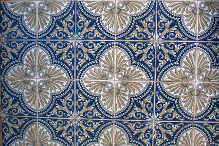 Fragment of portuguese traditional tiles Azulejo with pattern in old Porto, Portugal.