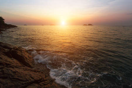 Sunset at rocky sea coast.の写真素材