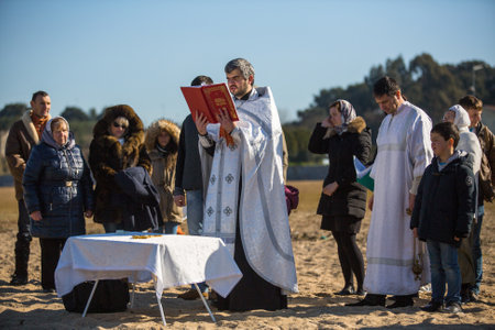 PORTO, PORTUGAL - JAN 19, 2017: Celebrating Baptism of Jesus and Epiphany bathing in Douro river in the Parish of Russian Orthodox Church. This is one of the holiest holidays for all Christians.のeditorial素材