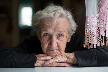 Closeup portrait of elderly woman looking at the camera.の写真素材