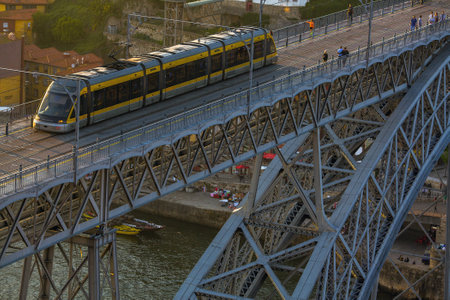 PORTO, PORTUGAL - APR 16, 2017: Train of Porto Metro in Old Town. The network has 6 lines and reaches seven municipalities within the metropolitan Porto area.のeditorial素材