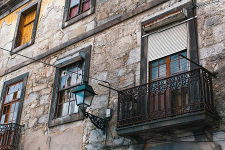 Facade of abandoned house buildings, Porto, Portugal. Ancient ruins of Europe.の写真素材