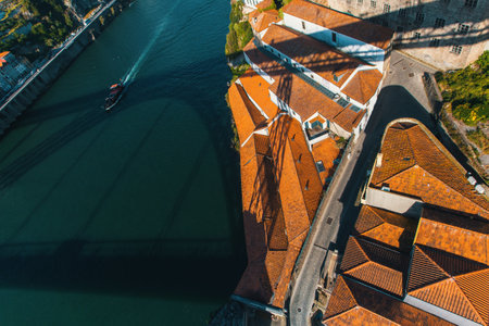 View of Douro river and buildings on the shore Vila Nova de Gaia from Dom Luis I bridge, Porto, Portugal.のeditorial素材