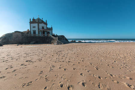 Chapel Senhor da Pedra on Miramar Beach (Praia de Miramar), Vila Nova de Gaia, Portugal.の写真素材