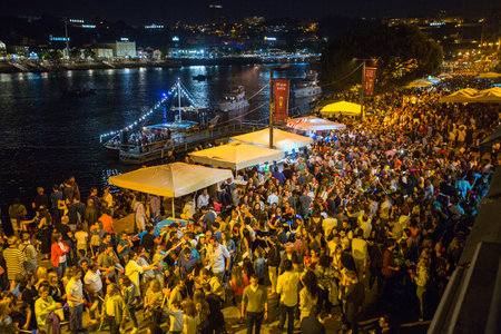 PORTO, PORTUGAL - JUN 24, 2017: Participants Sao Joao Festival (birth of St.John the Baptist) Very popular holiday is celebrated 23-24 June at midnight, next to the Douro River and Dom Luis I bridge.のeditorial素材