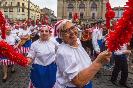 PORTO, PORTUGAL - JUN 25, 2017: Participants Festival of St John. Happens every year during Midsummer, thousands of people come to the city centre in a party that mixes sacred and profane traditions.のeditorial素材