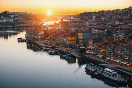 View of Ribeira on banks of Douro river during twilight, Porto, Portugal.の写真素材