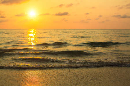 Wave of the sea softly surf in the rays of the setting sun.の写真素材