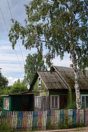 A typical residential wooden house in settlement in Leningrad region, Russia.の写真素材