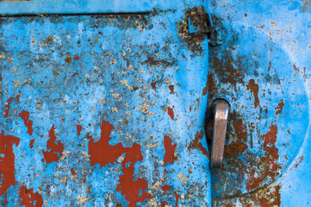 Texture rusty metal wall and door with peeling paint.の写真素材