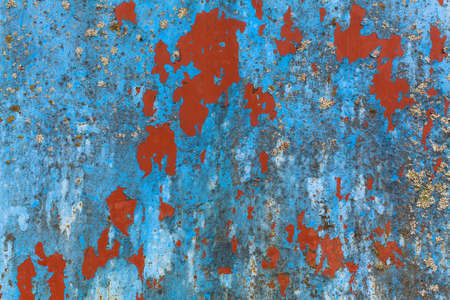 Texture rusty metal wall with peeling paint.の写真素材