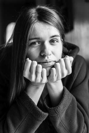 Attractive young long-haired woman. Seventies style closeup black-and-white portrait.の写真素材